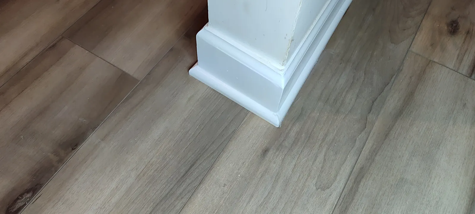Repaired and repainted column-base corner