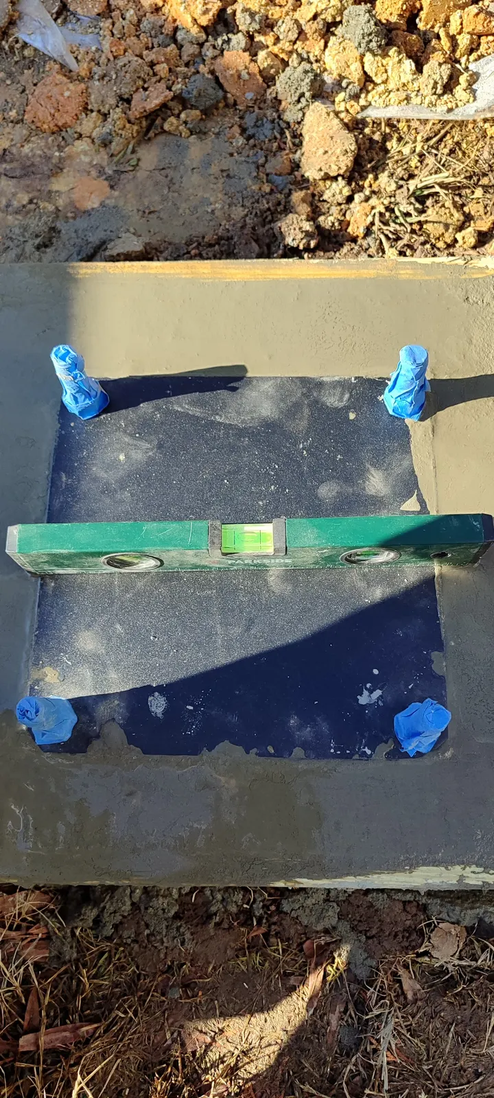 Level on the basketball hoop anchor plate
