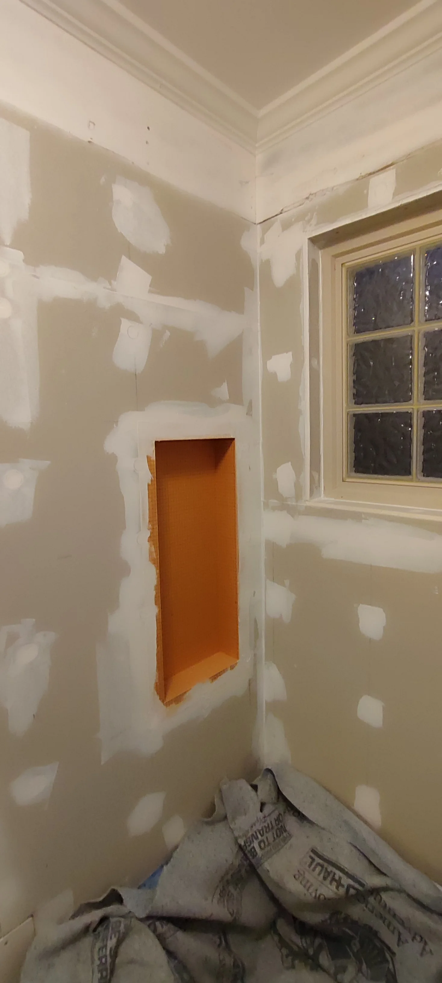 Left wall and recessed niche at the preparation stage, before tiling.