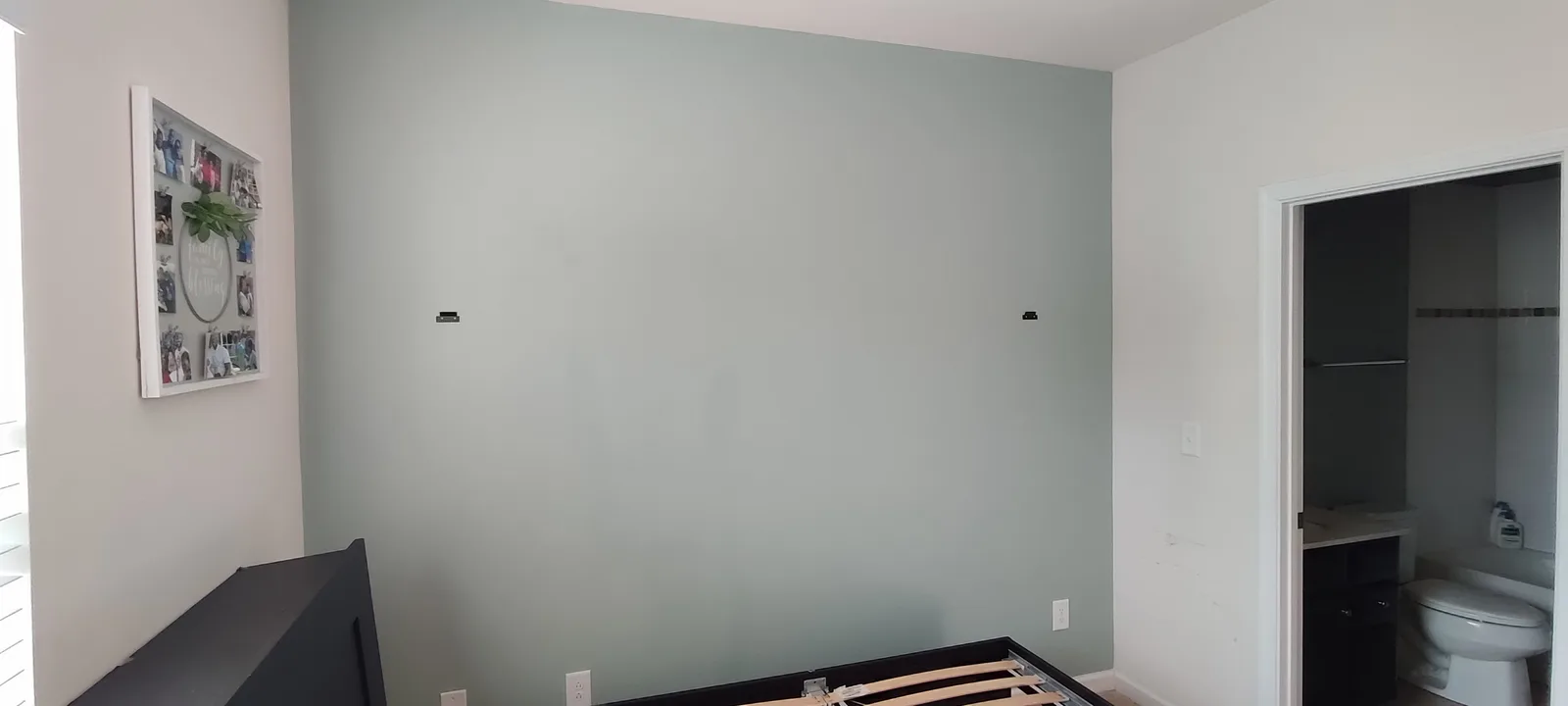 Painted accent wall in a bedroom after completion.