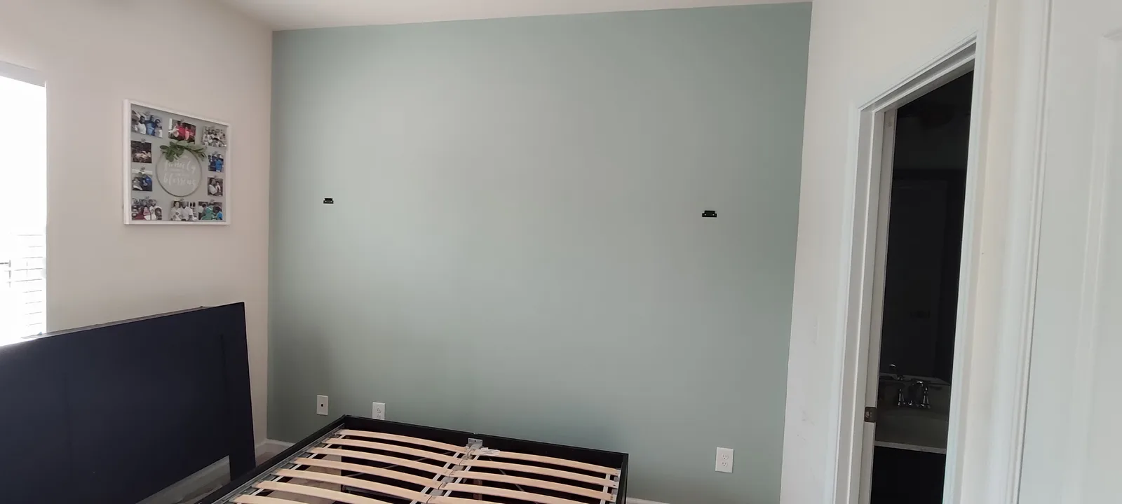 Finished painted bedroom wall, full room view.