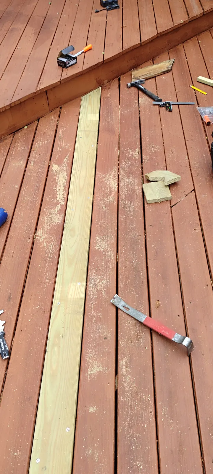 Replacement board fitted into the existing deck surface