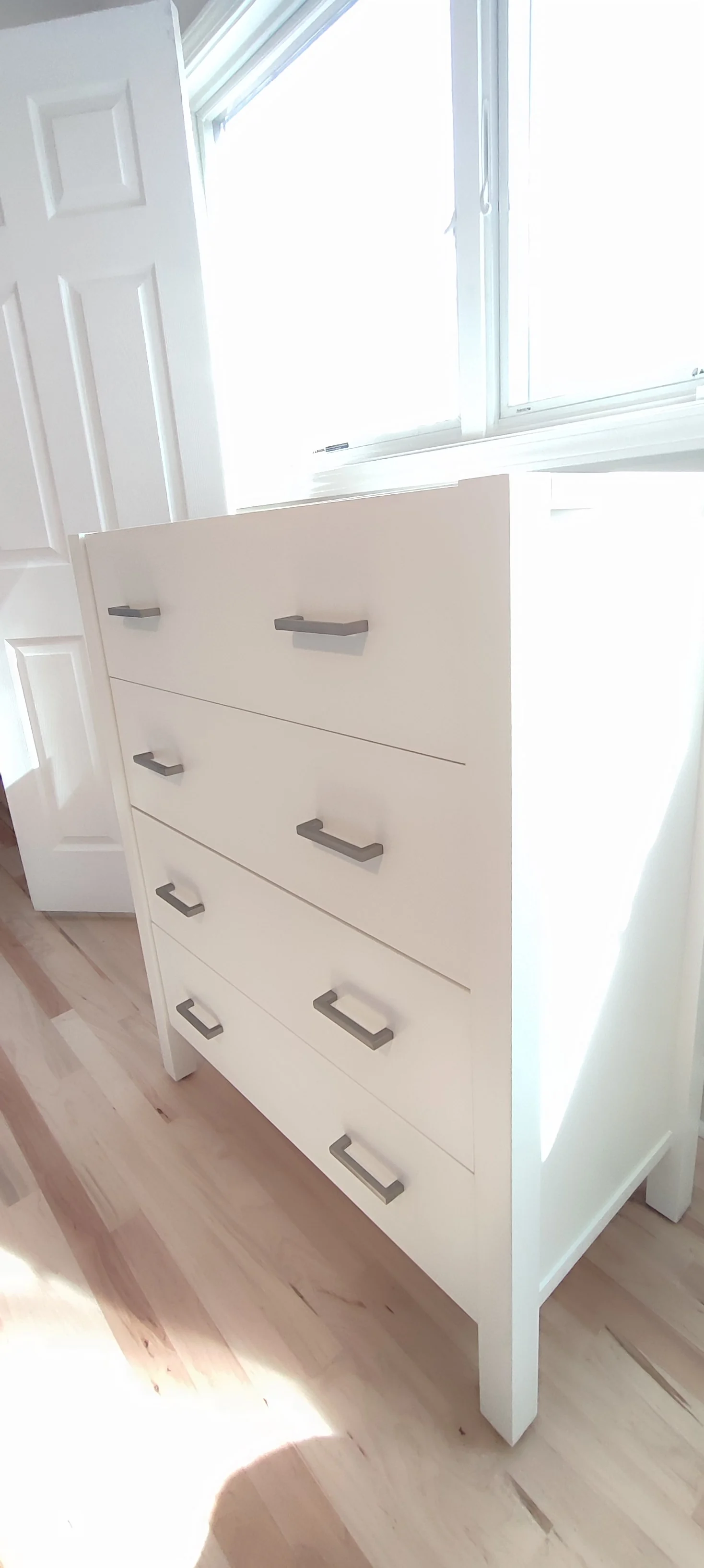Repainted tall white chest viewed from an angle