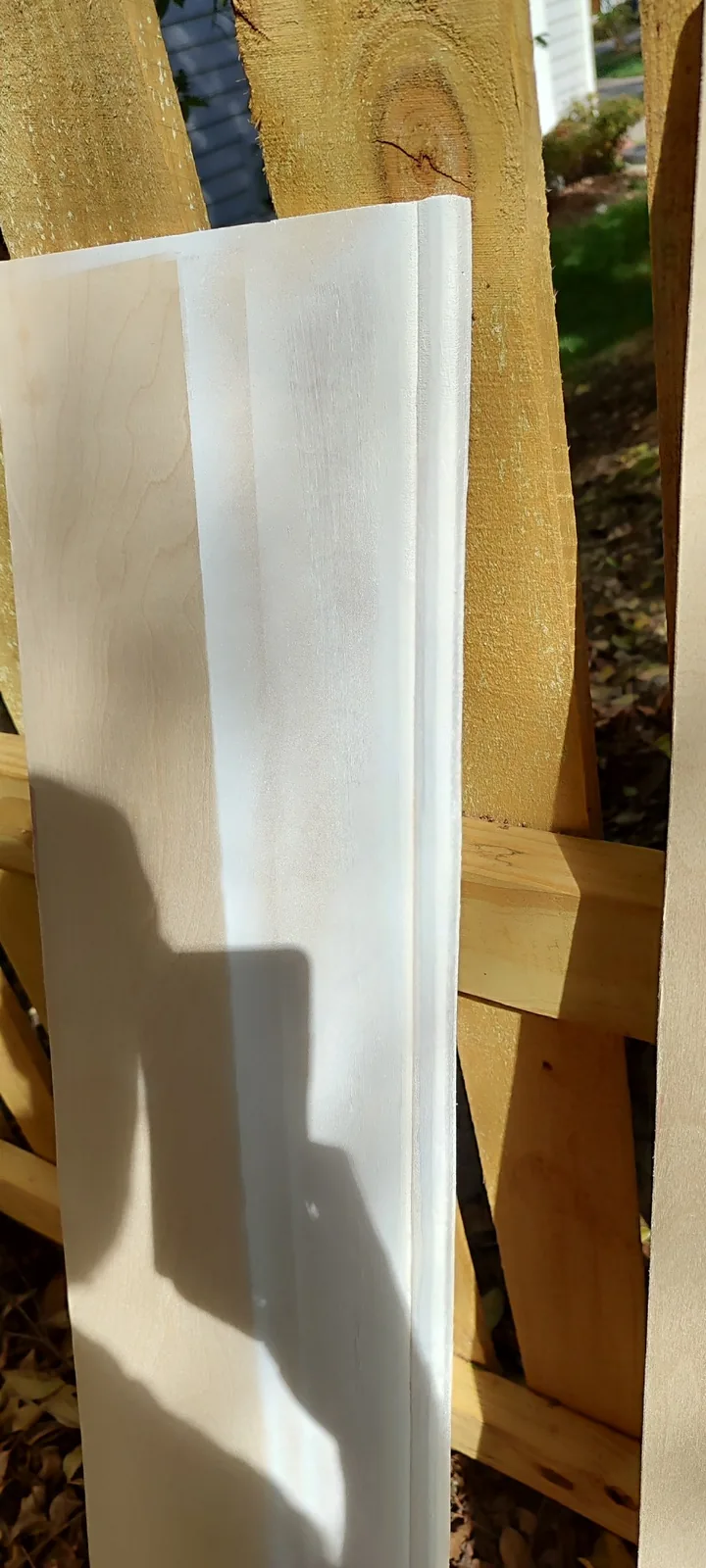 Primed custom siding panel ready for final fitting and installation