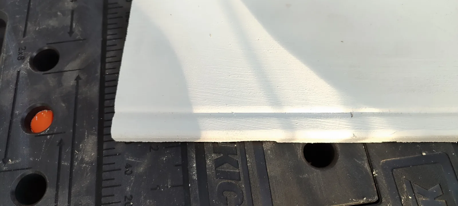 Fabricated exterior panel showing the routed profile before installation