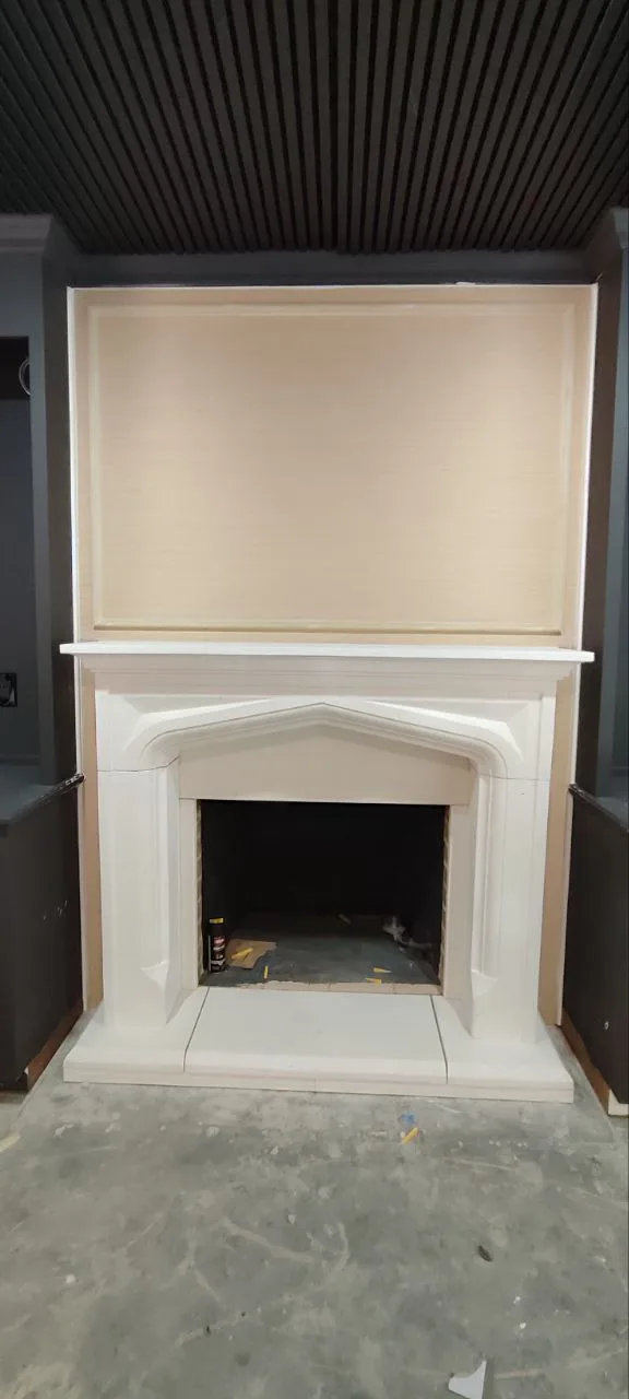 Assembled fireplace mantel after installation, full vertical view.