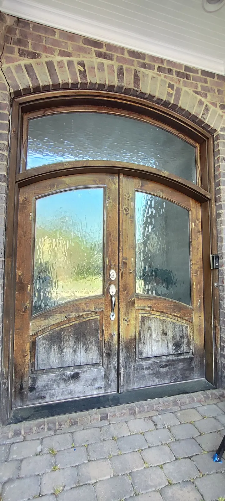 Double entry doors with a worn finish