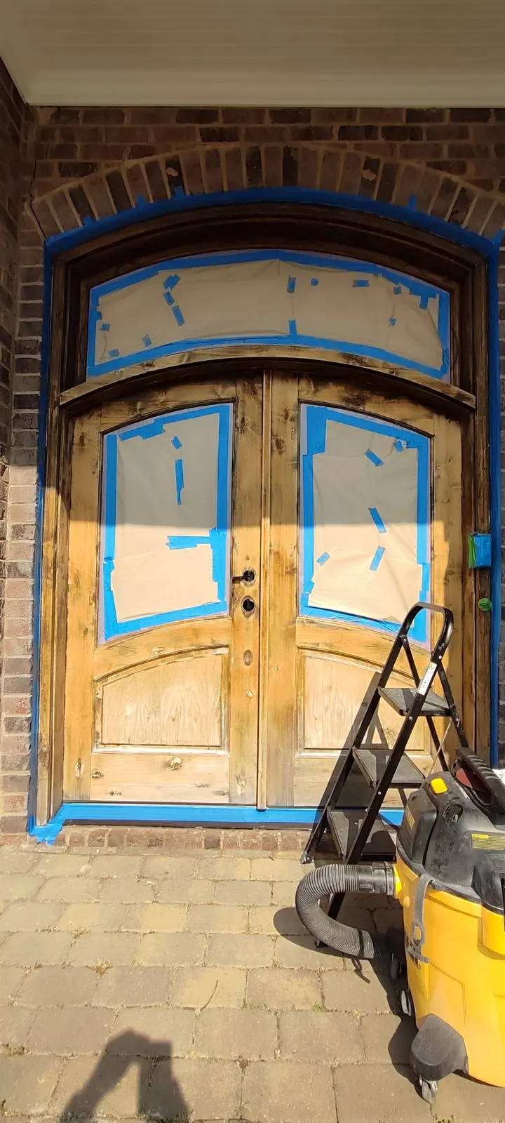 Door glass masked during refinishing