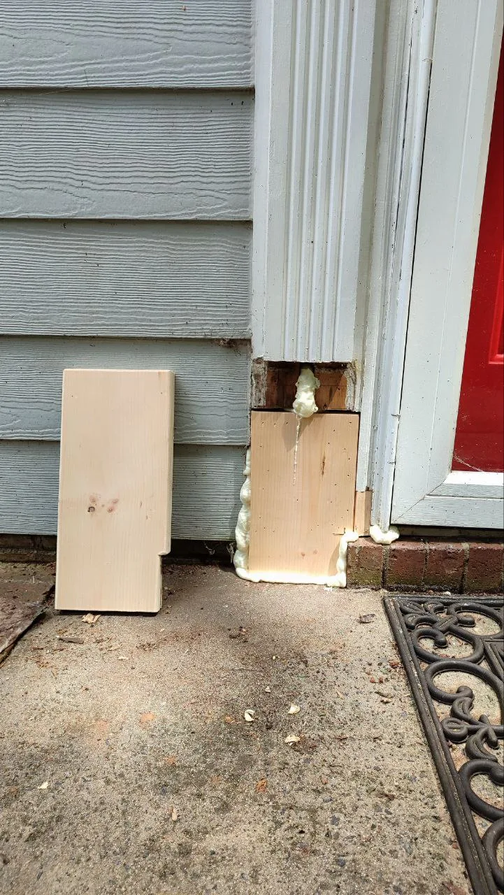 New trim piece being prepared for the front door repair.
