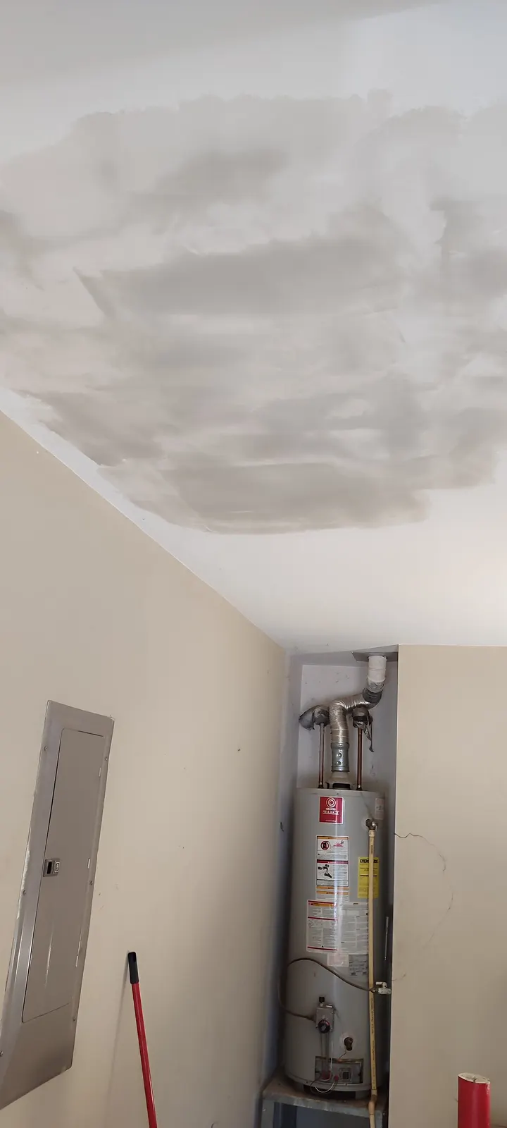 Portrait view of the ceiling repair during finishing