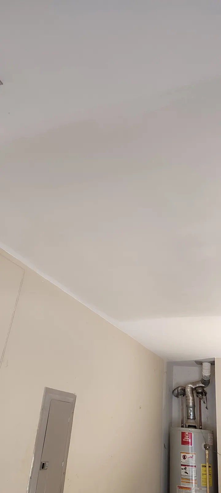 Repaired garage ceiling viewed toward the corner