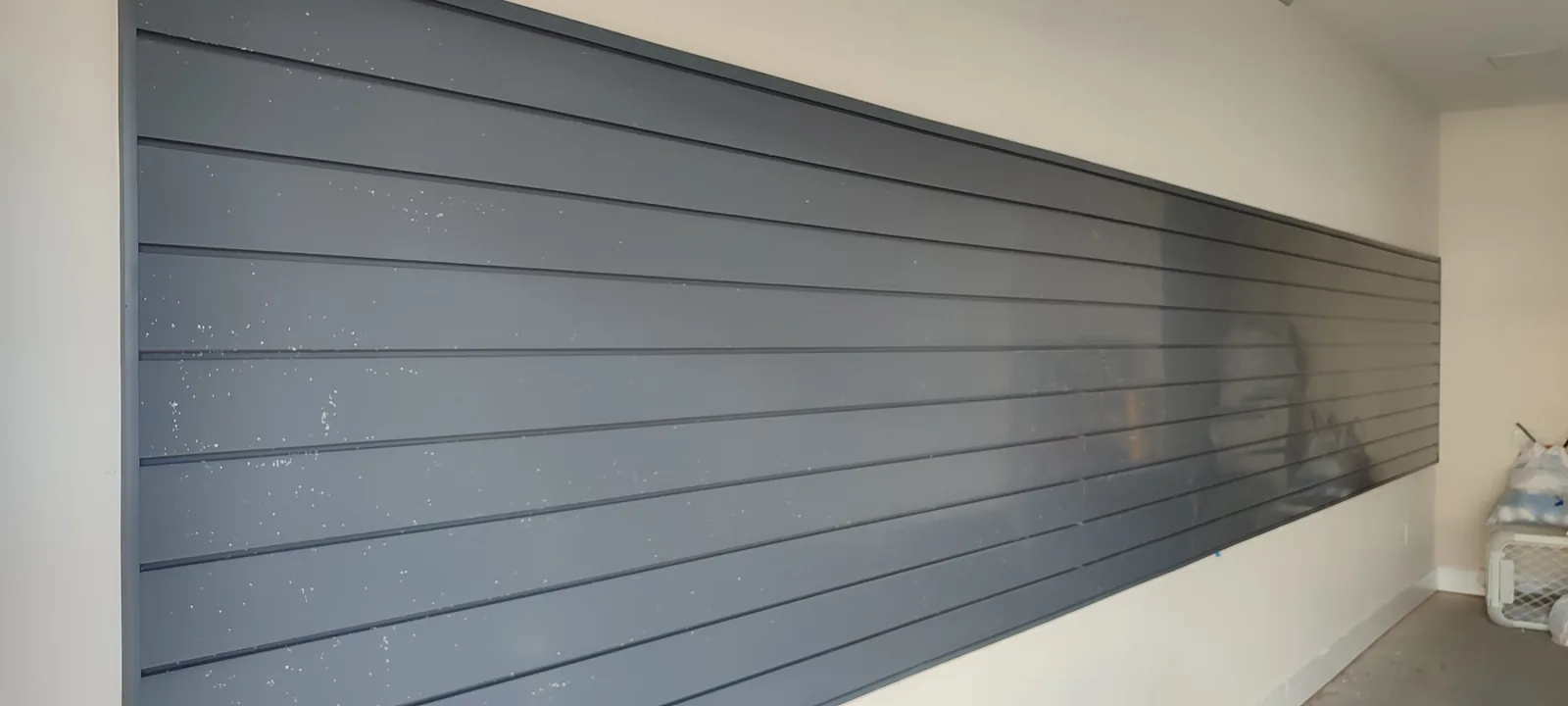 Close view of the aligned PVC garage slatwall panels before hooks were installed