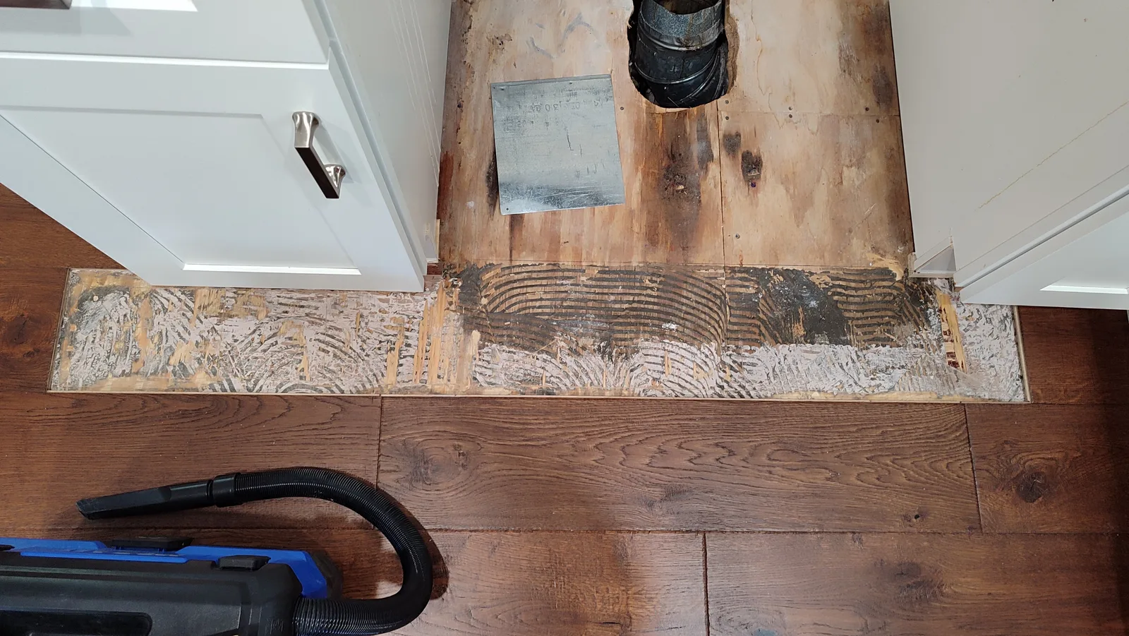 Prepared subfloor area where the electric stove is installed.