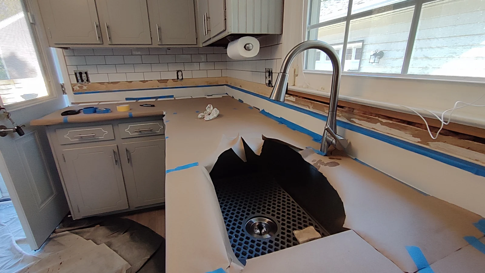 Protected sink and countertop before lower backsplash tile installation