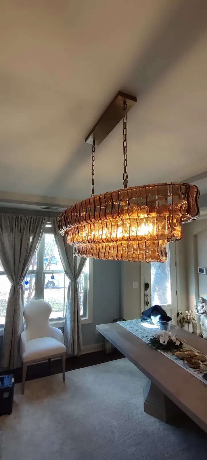 Portrait view of the illuminated chandelier in the room