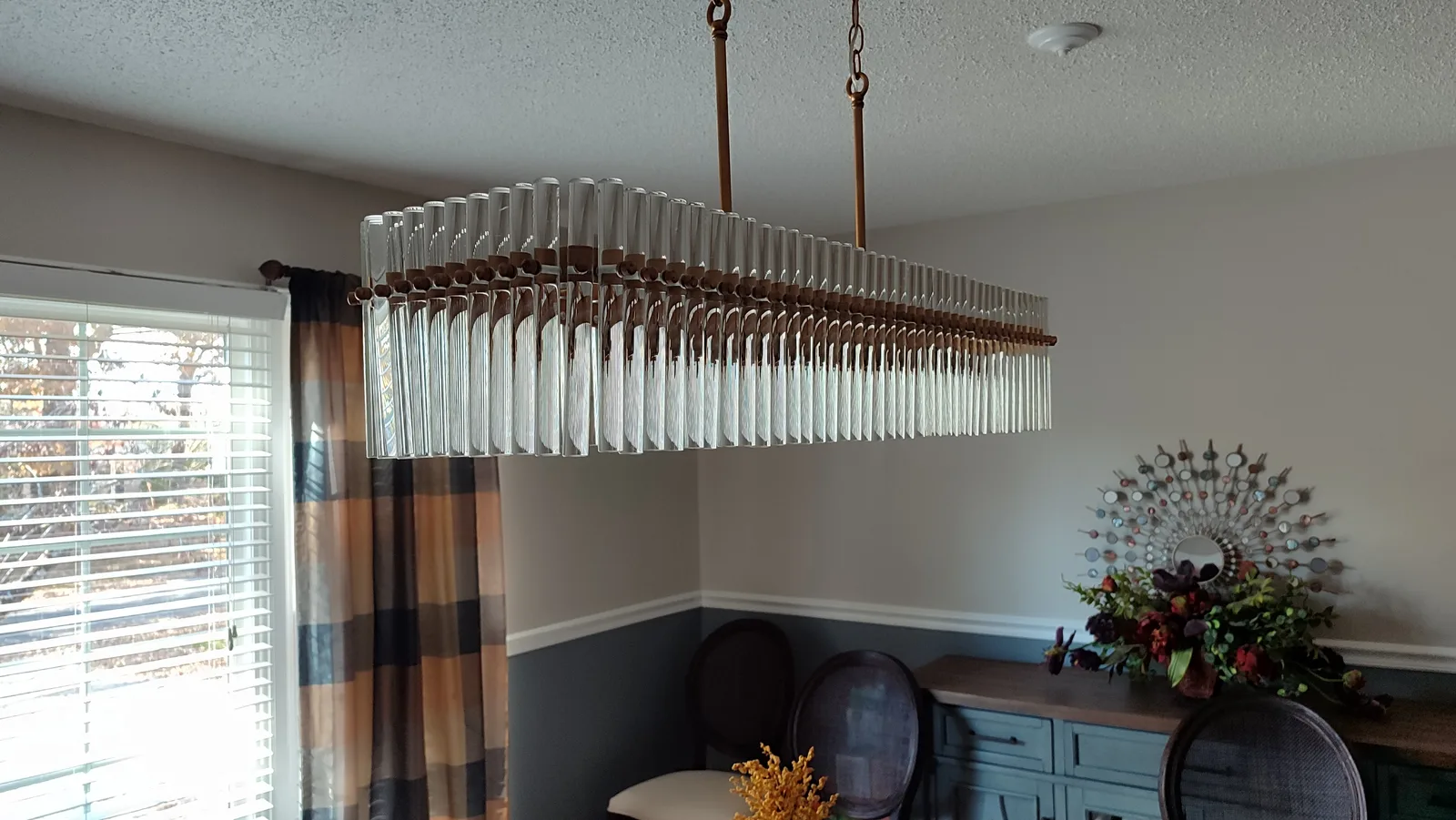 Linear ceiling light after installation, viewed from the window side.