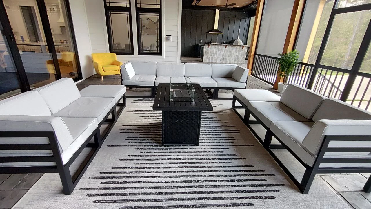Wide view of the outdoor seating group on the screened porch