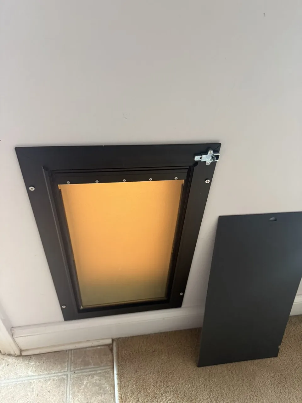 Installed pet door viewed from inside the room.
