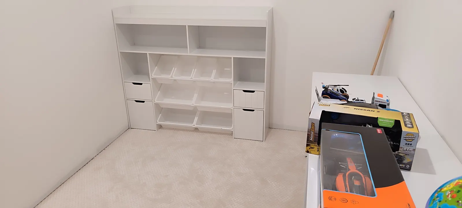 Playroom storage unit and worktable in the room