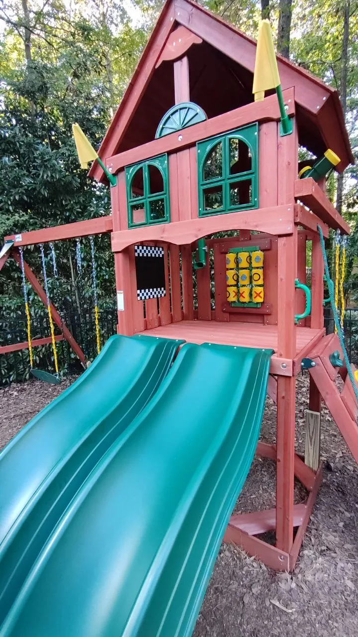Children's playset after assembly, close view of the tower and slide.