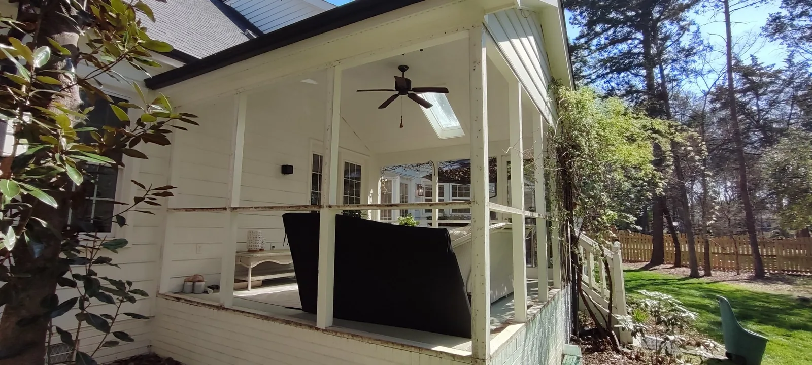Side section of the screened porch during screen replacement work