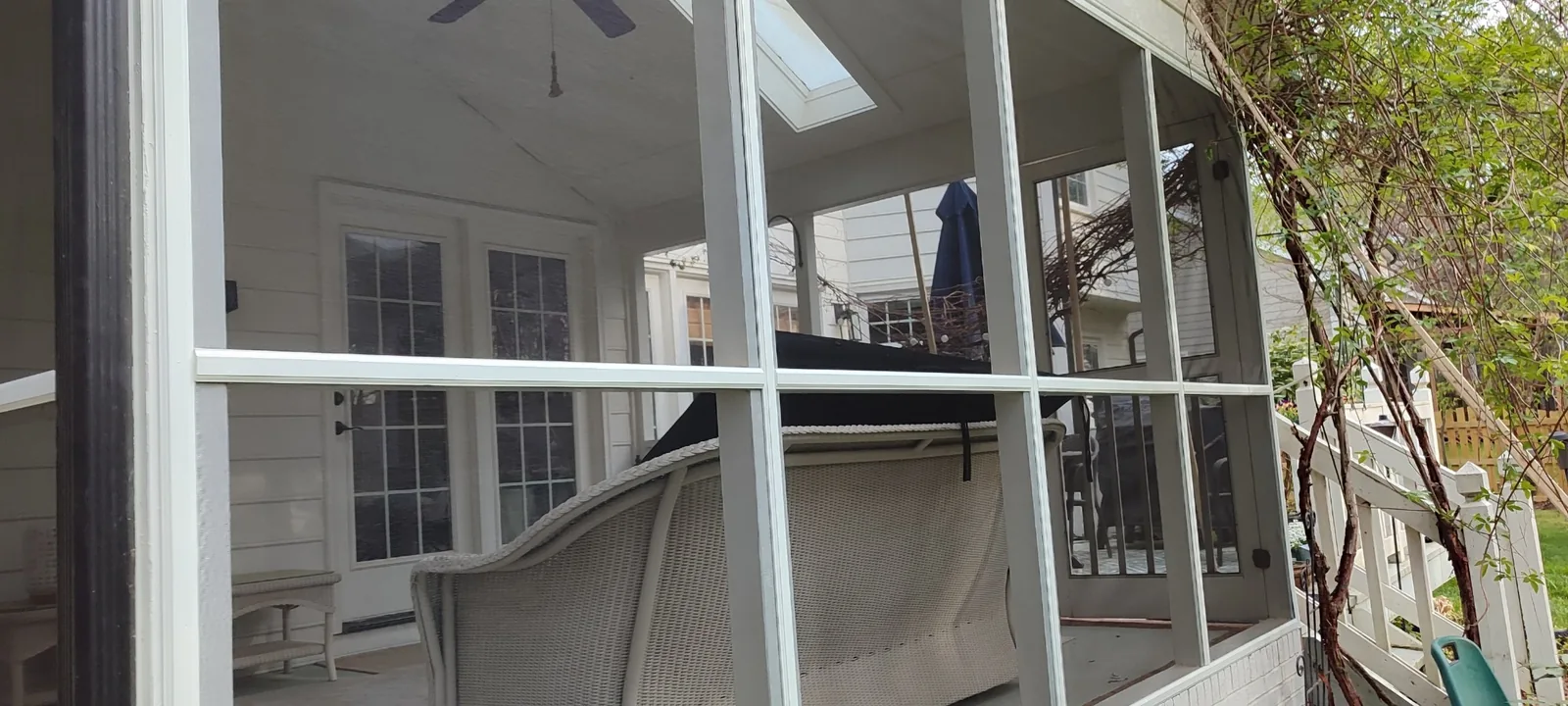 New screen mesh installed along the left side of the porch frame
