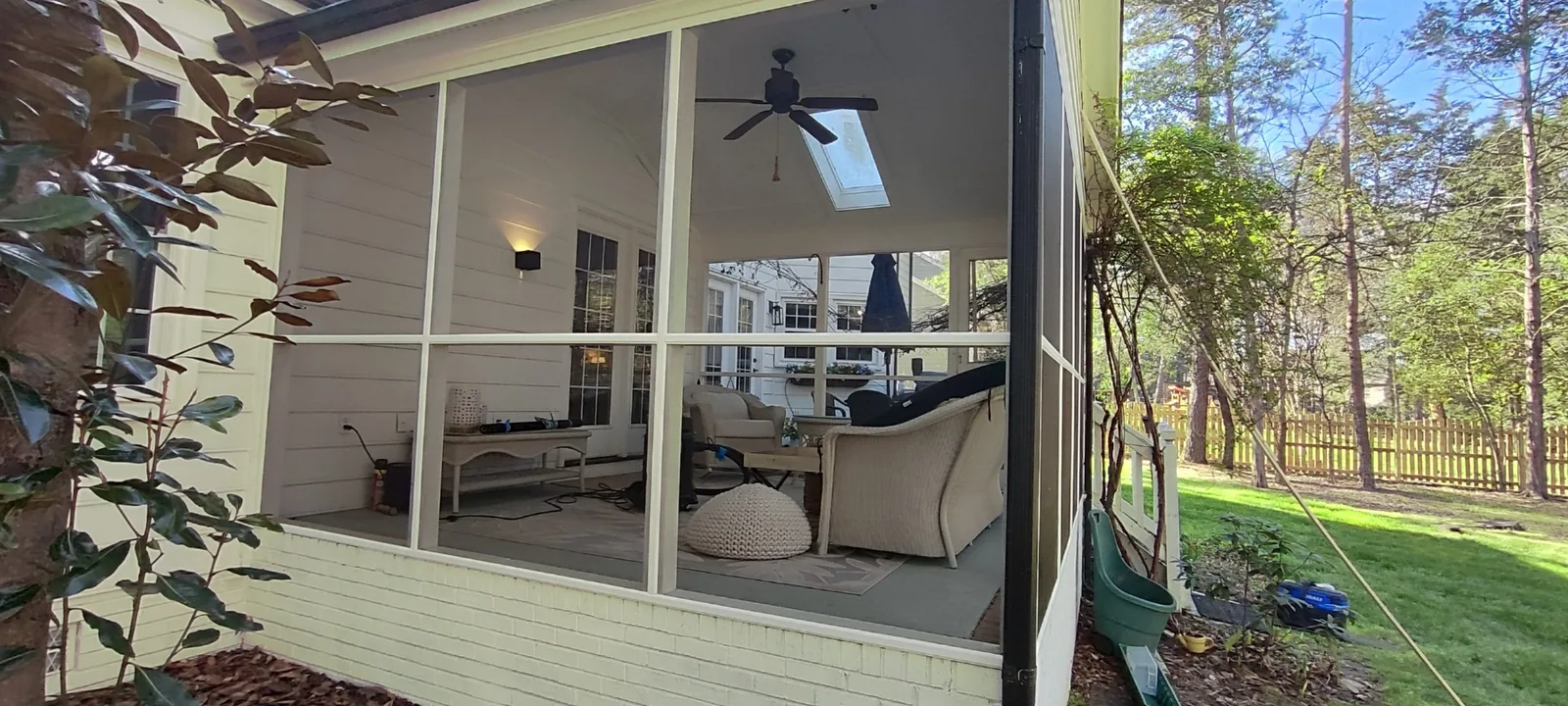 Finished screened porch side with new mesh and painted retaining trim