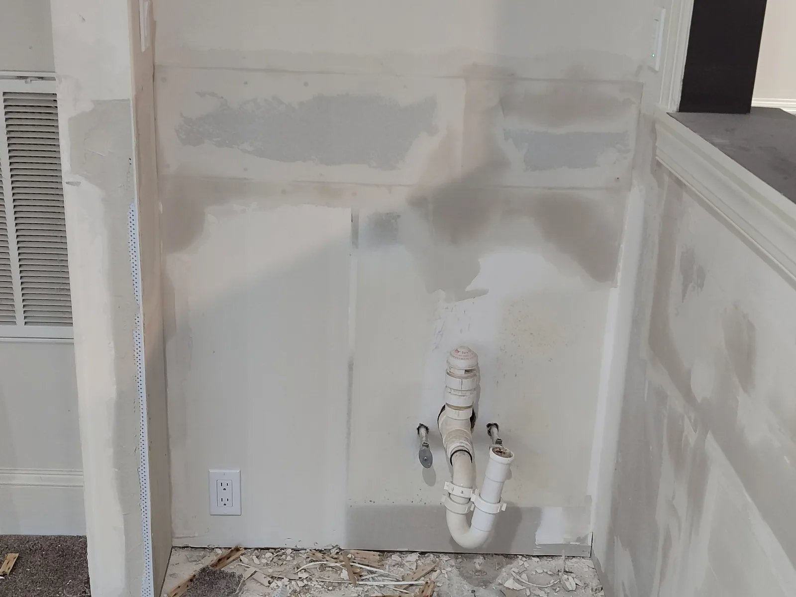 Small kitchen wall after drywall installation and finishing compound.