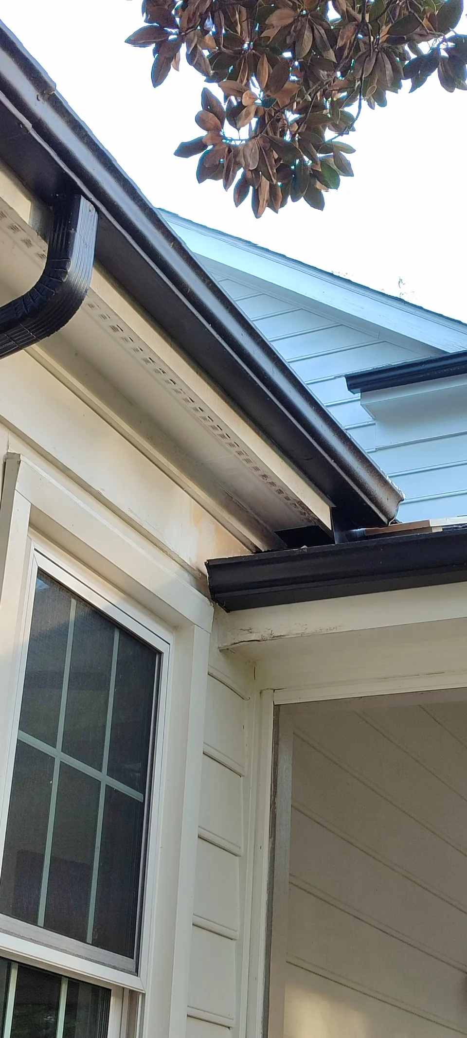 Roof corner after soffit and fascia restoration.