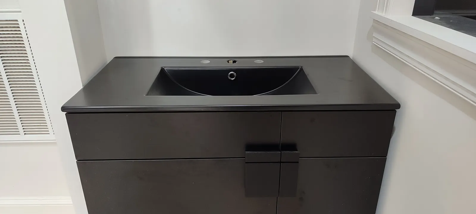 Dark sink top and front of the assembled vanity