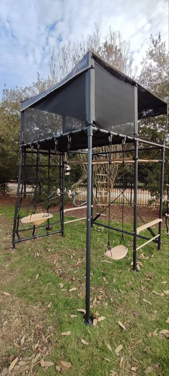 Full view of the assembled Vuly Quest outdoor playset in a backyard