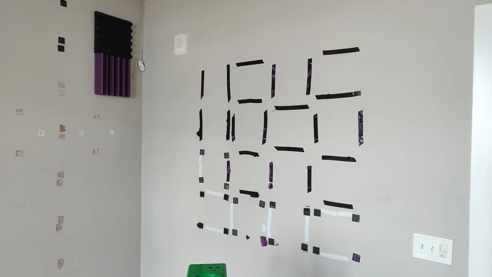Adhesive strips remaining on the entry wall during panel removal