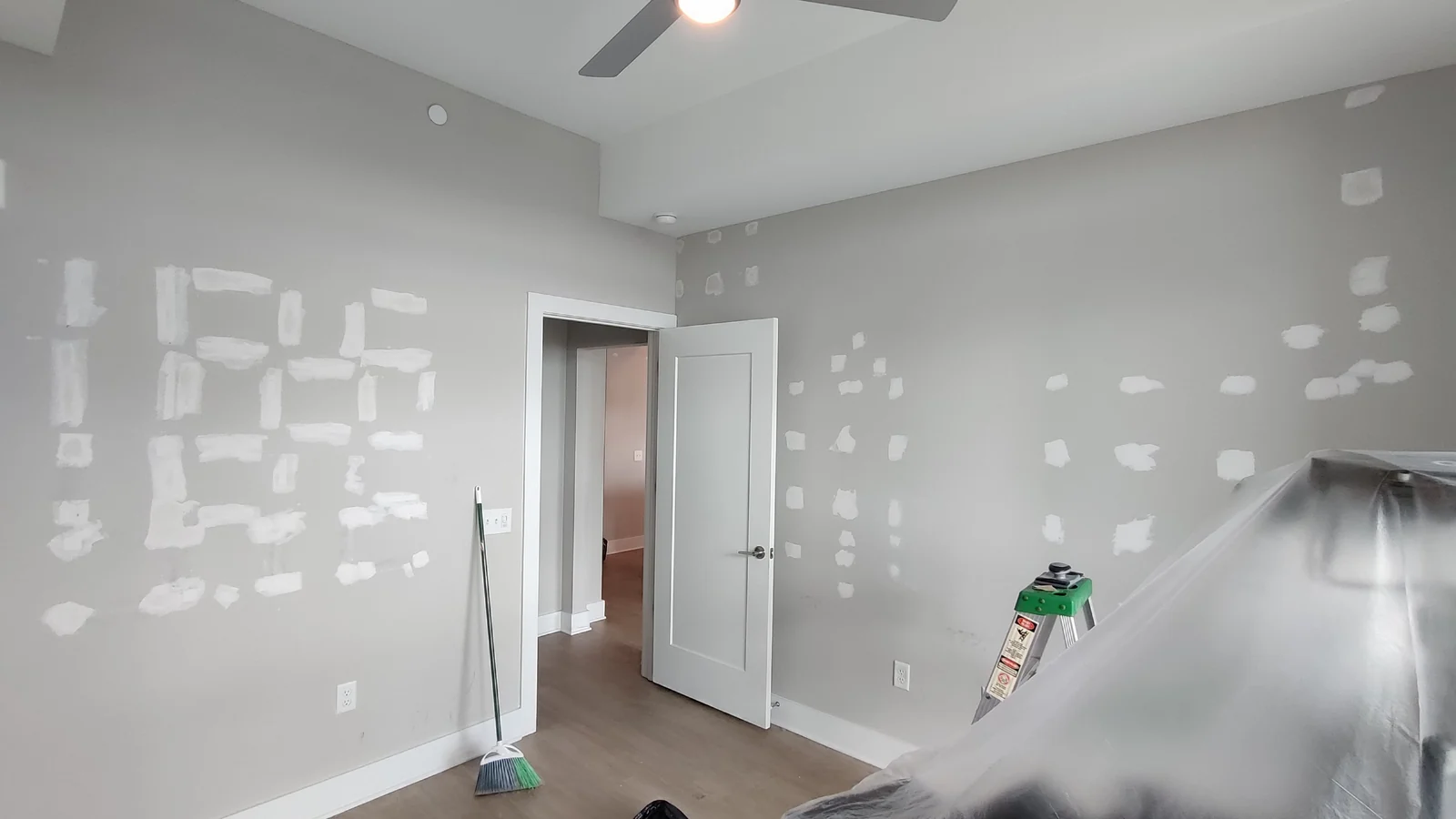 Patched walls surrounding the open room entry