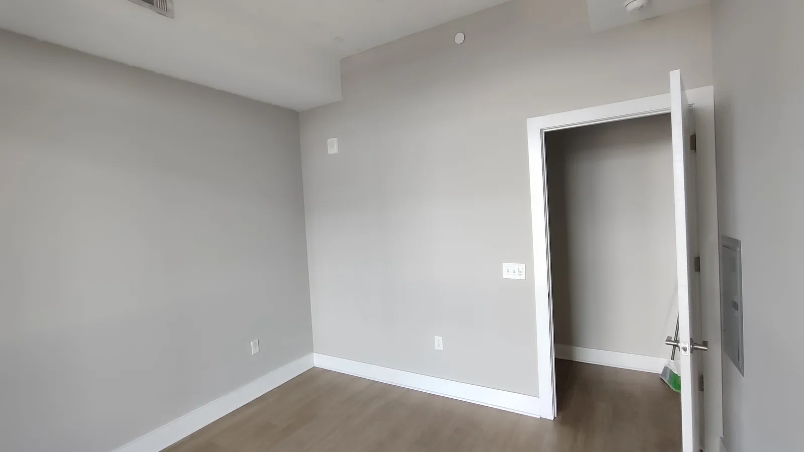 Repainted walls beside the open entry door